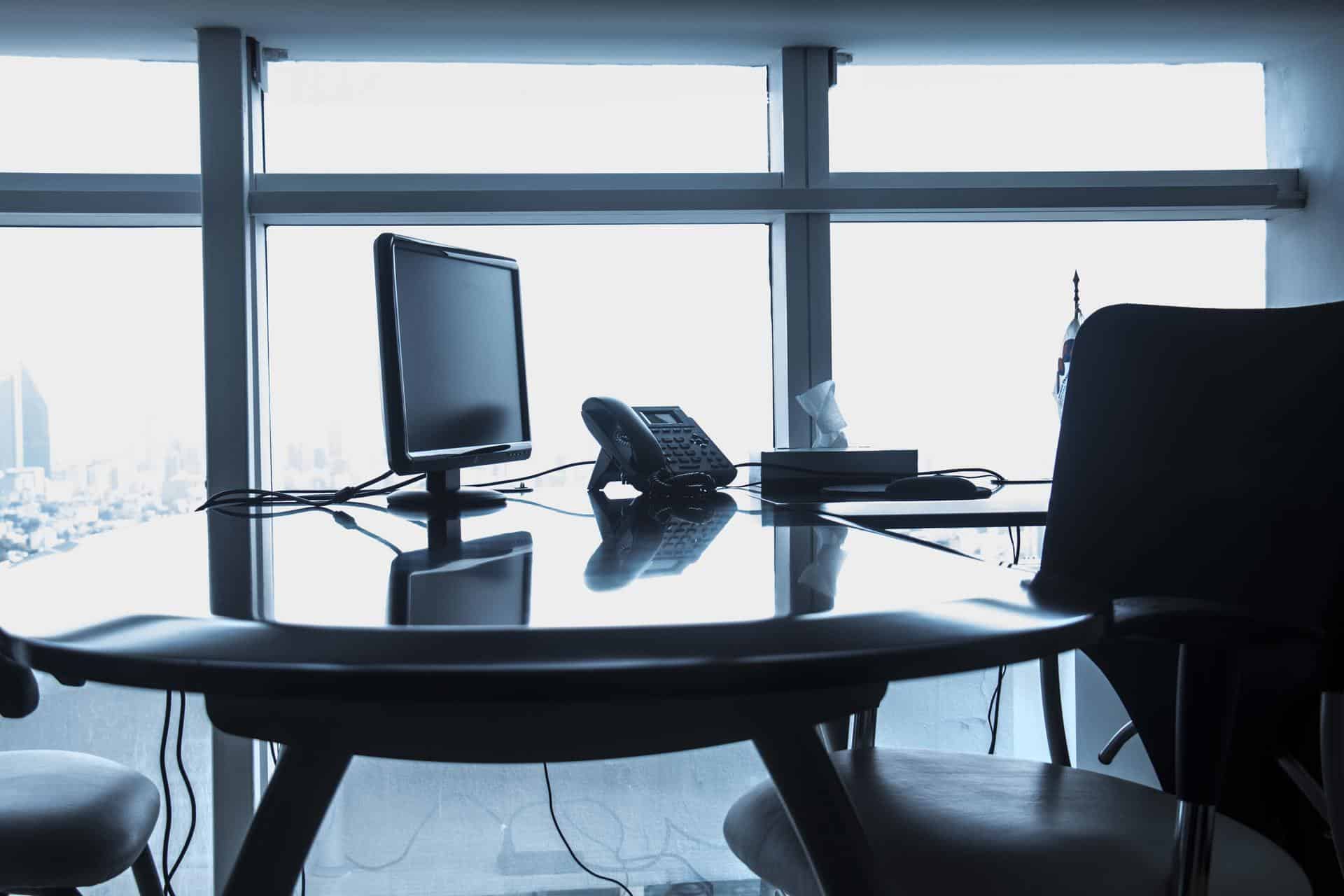 Desk in Office with Chair and Phone