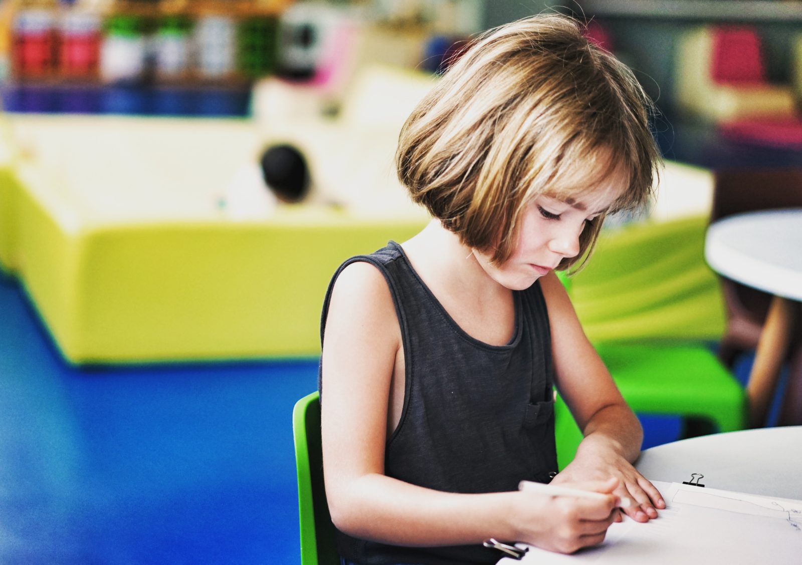 Girl writing at Desk