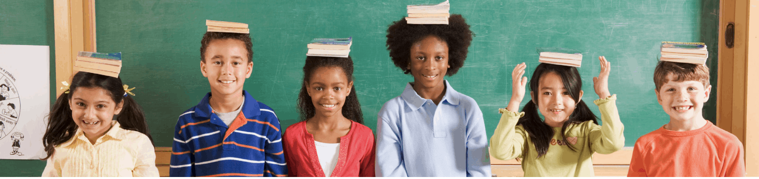 Students with Books on Heads