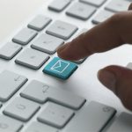 Business e-mail on a computer keyboard.