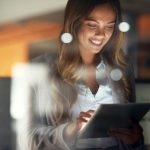 Shot of a young attractive businesswoman working late at night in a modern office